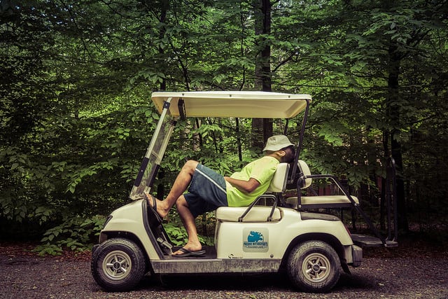 Man Sleeping on Golf Cart, golf cart insurance