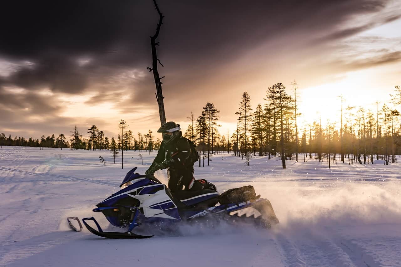 Riding a snowmobile in winter